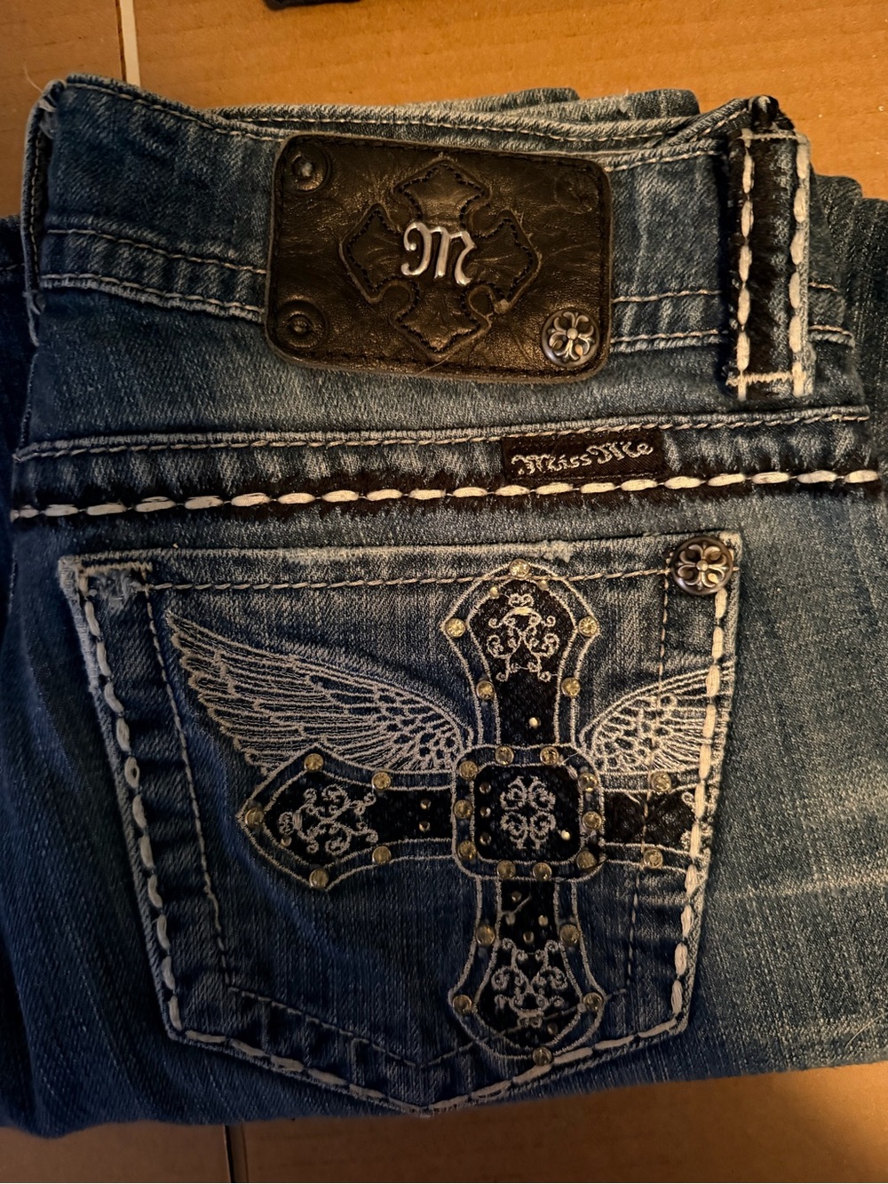 Miss Me Blue Denim Boot Cut Jeans with Embroidered Winged Cross